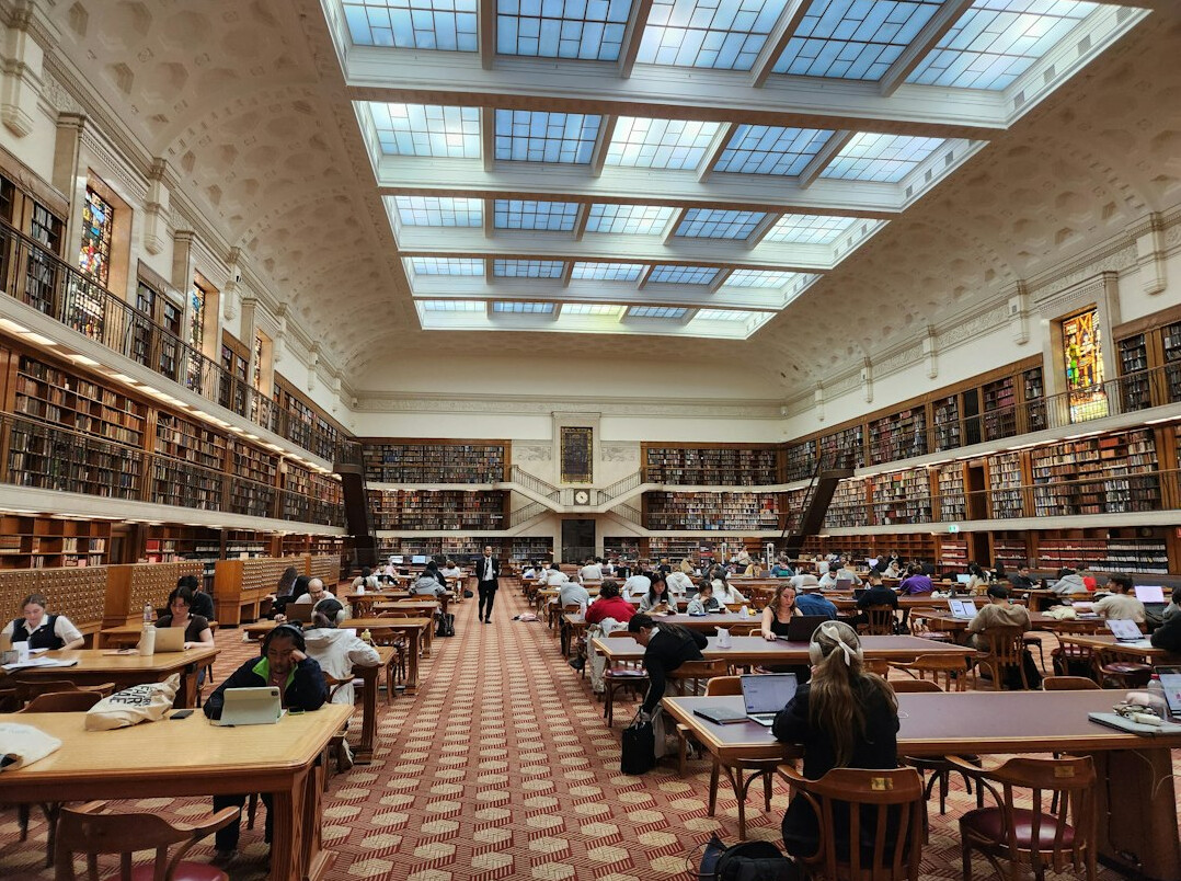 Historic library hall with rows of shelves