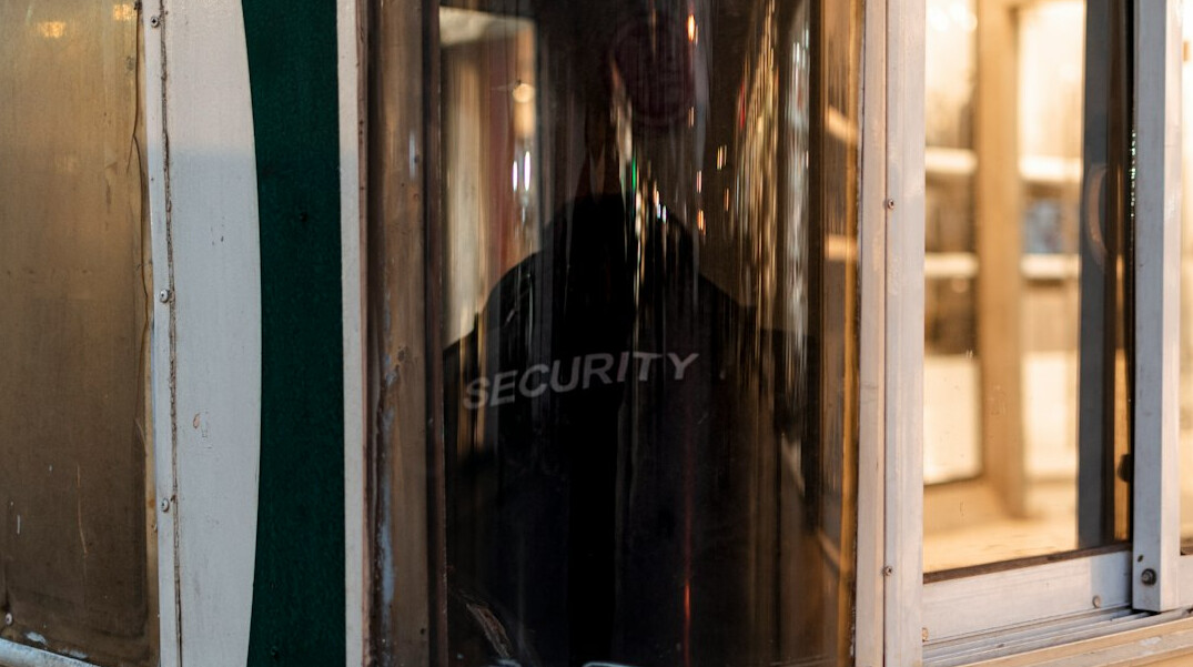 store detective watching customers
