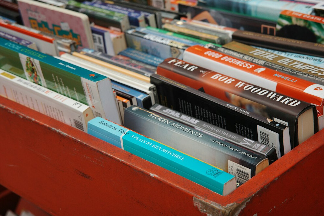 Rows of old books on library shelves